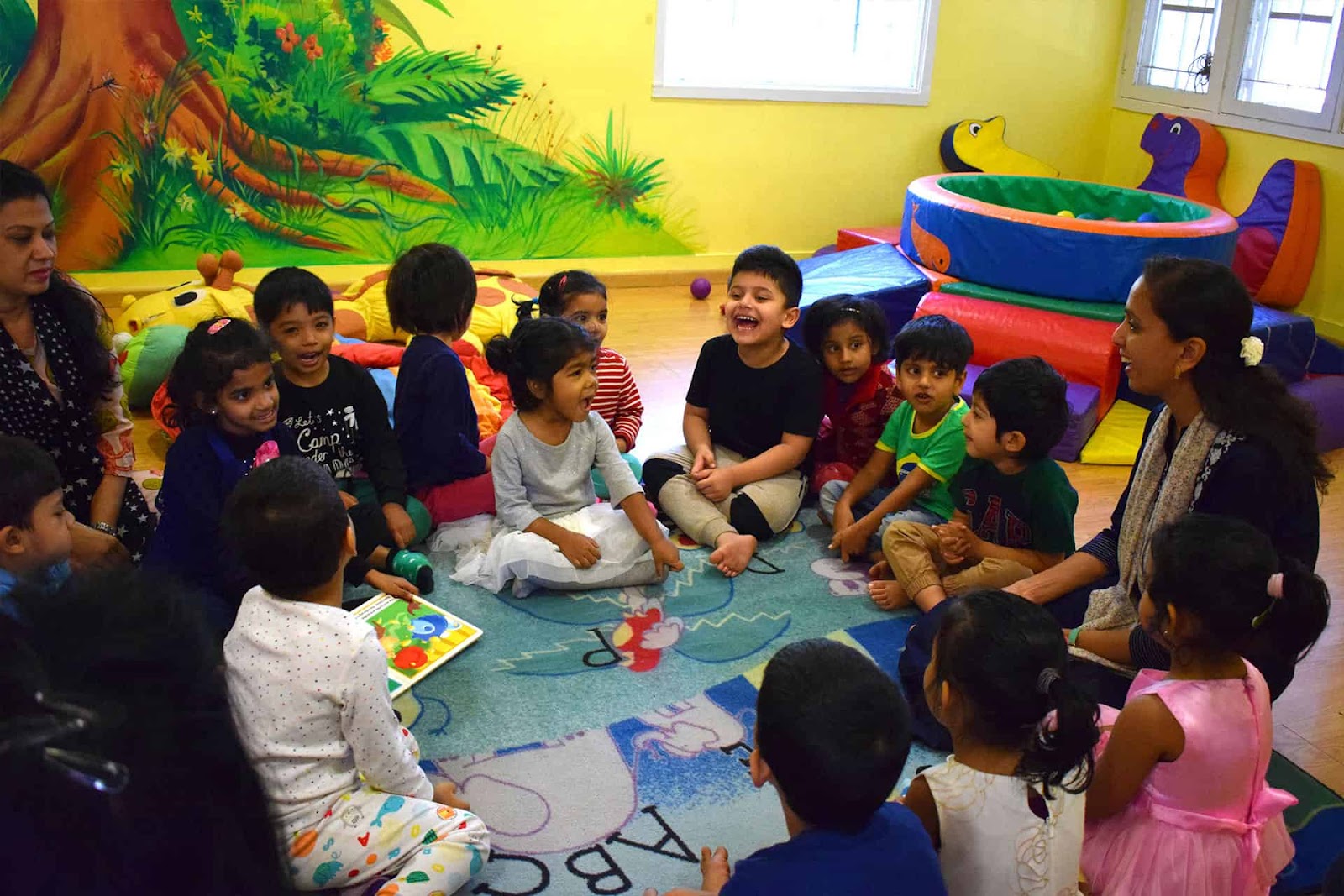 Children sitting in circle having their reading activity at Preschool in Marriottsville, Maryland